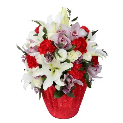 For Lovely Woman Flower Arrangement with cymbidium, lilies, carnations, and lisianthus in a handmade red vase available in Dubai