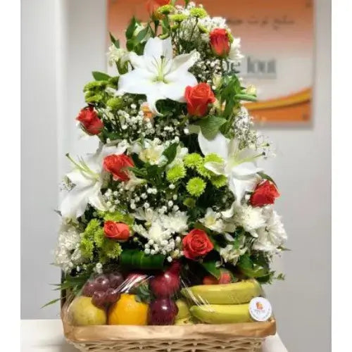 A Bountiful Harvest get well gift basket with fresh flowers and seasonal fruits in Dubai, UAE