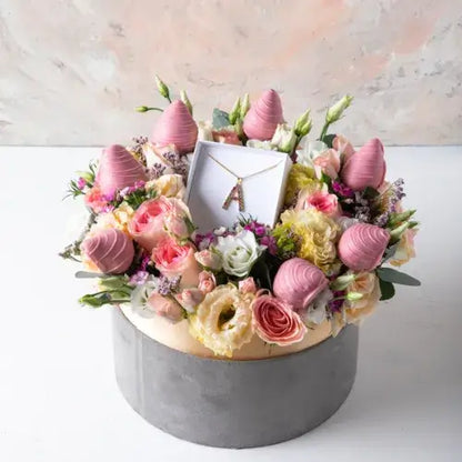 Luxurious gift hamper featuring a pastel flower arrangement and Ruby chocolate-covered strawberries