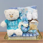 Luxury baby gifts Dubai, UAE - Essential Little Goodies hamper with chocolates, teddy bear, and baby essentials.