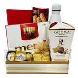Stylish corporate gift basket with chocolates, shortbread & a reusable water bottle (UAE).
