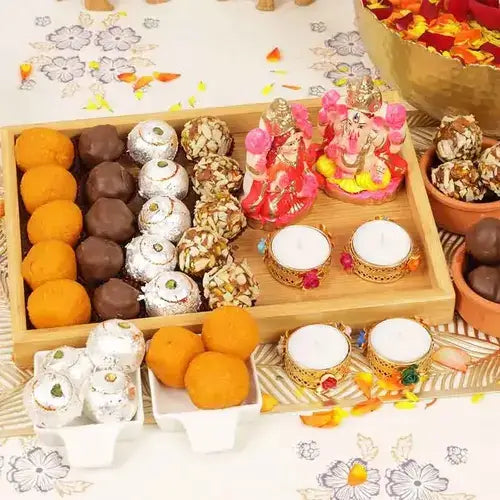 Diwali sweets tray with Laxmi Ganesha idols