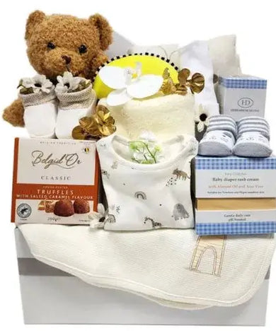 Deluxe baby gift set with soothing essentials, adorable clothes & treats for parents (UAE).
