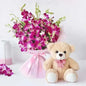 Soft teddy bear with purple orchids gift combo for UAE delivery