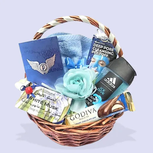 Pamper Hamper for Him featuring Adidas shower gel, Godiva chocolate bar, Police Eau de Toilette and more. perfect gift for men in Dubai, UAE