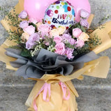 Celebrate a birthday with a bang! Bouquet with roses, balloons, and gift wrap, delivered fresh across UAE.