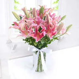  Send a celebratory gift! Pink lilies & fudge cake, delivered fresh across UAE.