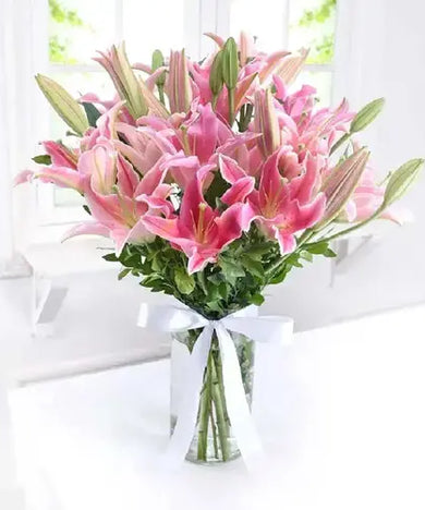  Send a celebratory gift! Pink lilies & fudge cake, delivered fresh across UAE.