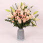 Pink lily and rose bouquet with baby blue eucalyptus in a blue vase. Dubai delivery (UAE)