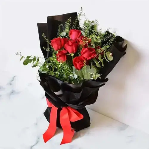 Send a luxurious gift! Red roses & triple chocolate cake, delivered fresh across UAE.