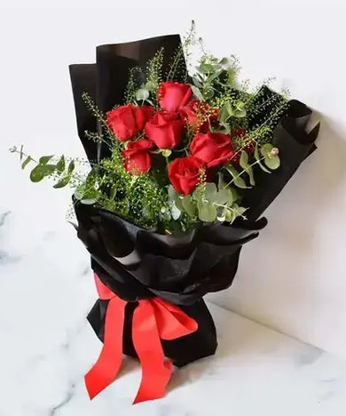 Elegant red rose bouquet with triple chocolate cake, perfect for a romantic evening.