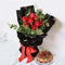 Gift basket with red roses, eucalyptus & triple chocolate cake. Romantic flower & cake delivery UAE.