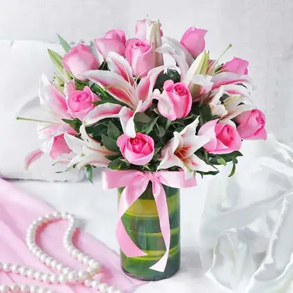 Gift set with pink roses, lilies & black forest cake. Appreciation gift with flower & cake delivery UAE.