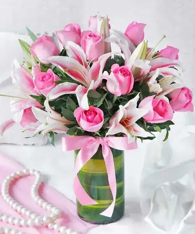 Gift set with pink roses, lilies & black forest cake. Appreciation gift with flower & cake delivery UAE.
