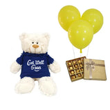 Send a thoughtful get well gift with this teddy bear, chocolates & balloons set (UAE).