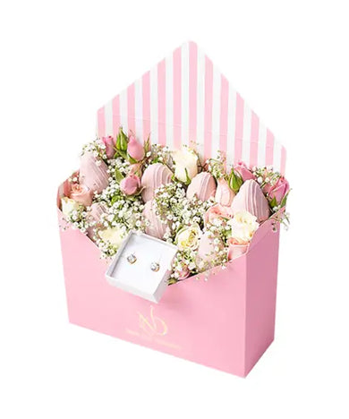 Send a luxurious gift box with flowers, chocolates & earrings to Dubai