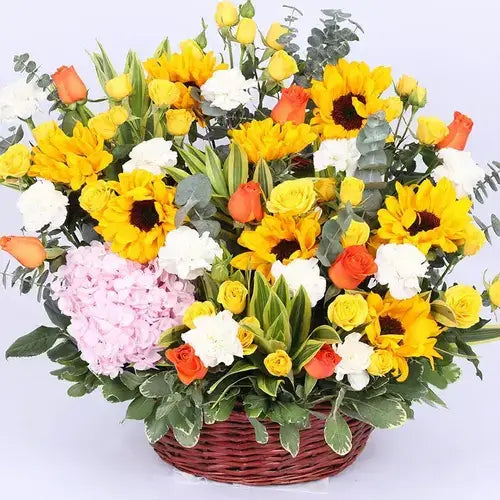 Send a burst of sunshine! Flower basket with sunflowers, roses, and more, delivered fresh across UAE.