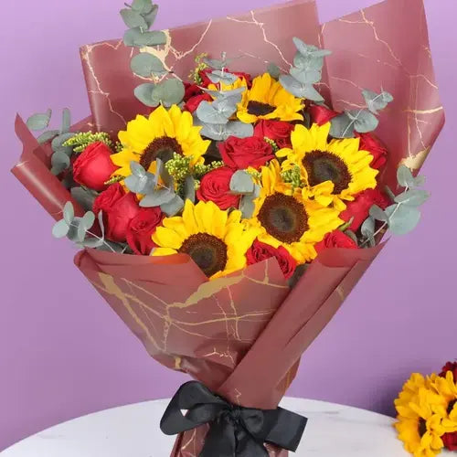 Send a bouquet of sunshine! Sunflowers and red roses arranged for any occasion in UAE.