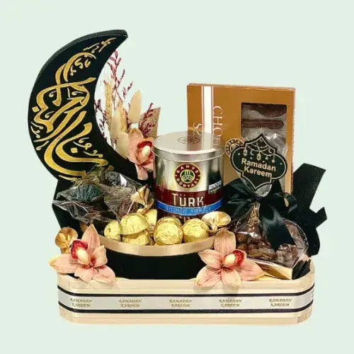 Sweet Ramadan gift box with chocolates, dates, and Turkish coffee in a keepsake velvet crescent box.